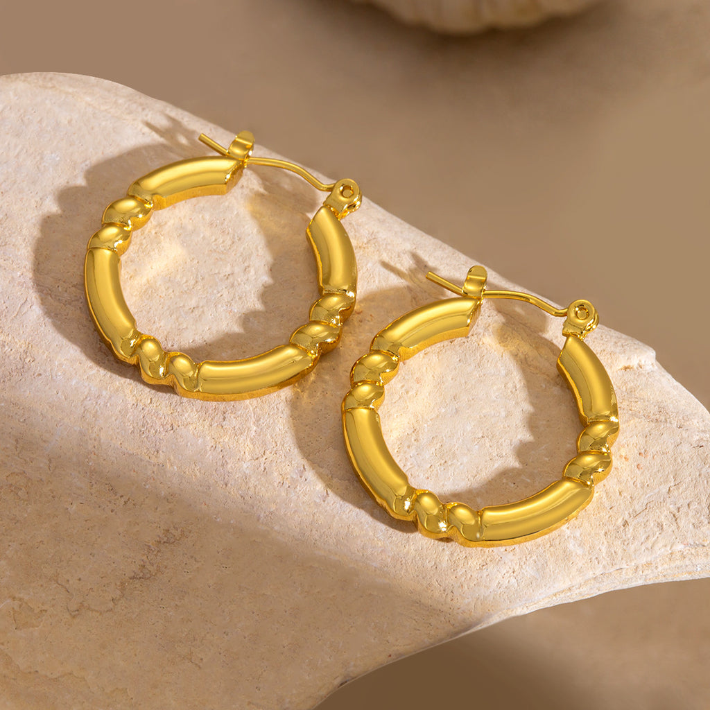 Hydrauliska örhängen i titanstål som inte bleknar