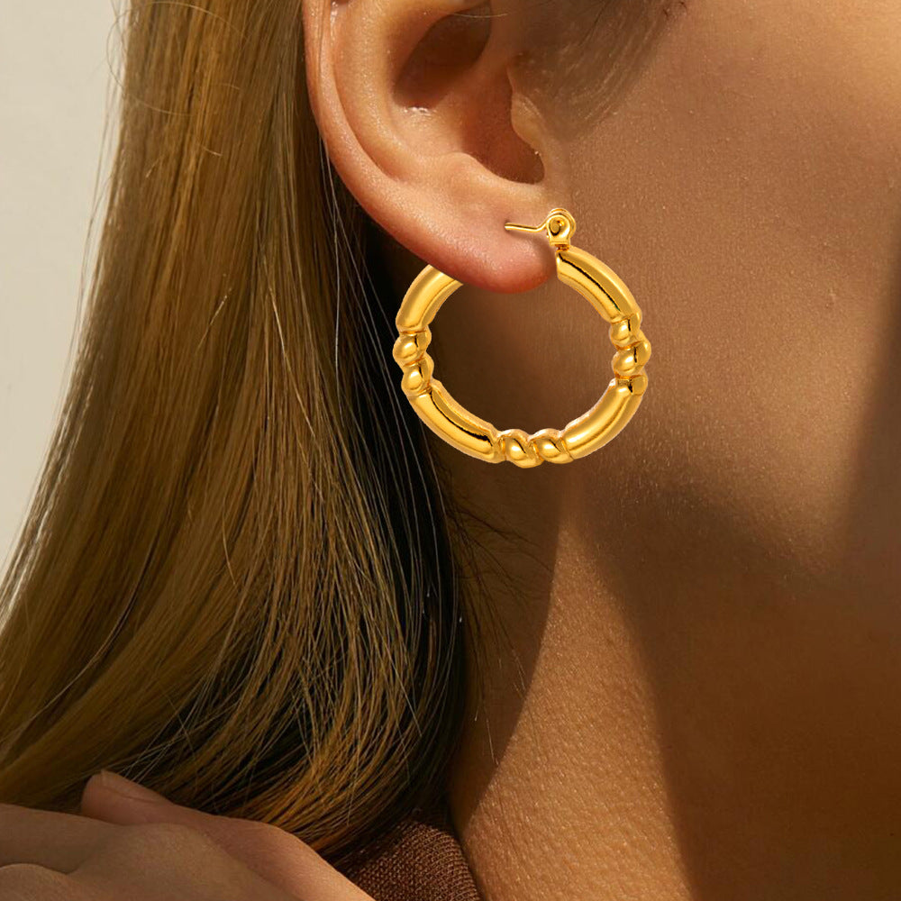 Hydrauliska örhängen i titanstål som inte bleknar